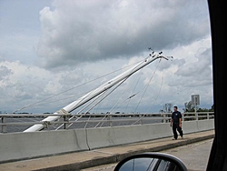 Hurricane aftermath from Stuart FL-sailboat-mast-over-bridge.jpg